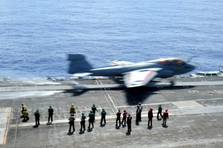 US Navy 100921-N-7191M-016 Sailors stand by as an EA-6B Prowler assigned to the Gauntlets of Electronic Attack Squadron (VAQ) 136, launches from th