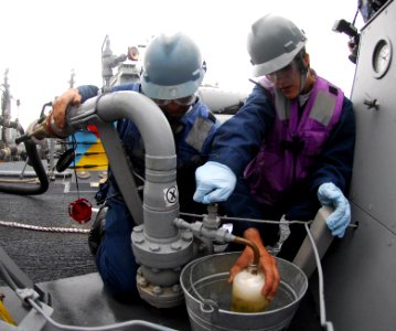US Navy 100923-N-2855B-152 Cryptologic Technician 3rd Class Douglas Safratowich, left, and Gas Turbine System Technician Fireman Melissa Strain ob