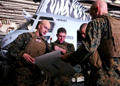 US Navy 100919-N-9950J-047 Marines assigned to the 31st Marine Expeditionary Unit (31st MEU) conduct a map study aboard the forward-deployed amphib
