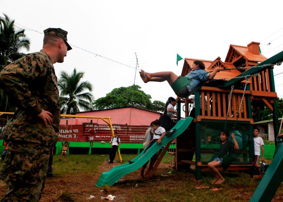 US Navy 100924-M-6740B-391 Lt. Col. Chris S. Richie watches as Nicaraguan children play at the playground that U.S. Marines and Sailors installed