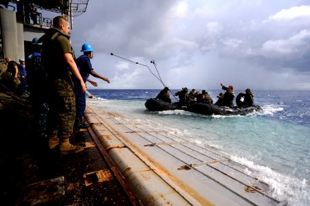 US Navy 100919-N-8335D-539 Marines assigned to the 31st Marine Expeditionary Unit (31st MEU) in combat rubber reconnaissance craft approach the ste photo