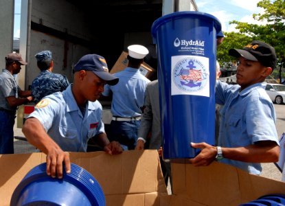 US Navy 100920-N-4971L-048 Members of the Dominican Republic defense forces load pallets of Project Handclasp humanitarian aid delivered by High Sp