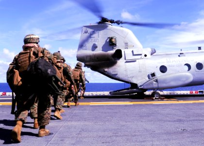 US Navy 100919-N-9950J-386 Marines assigned to the 31st Marine Expeditionary Unit (31st MEU) board a CH-46E Sea Knight helicopter aboard the forwar photo