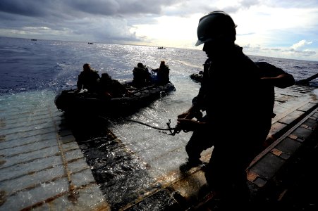 US Navy 100919-N-8335D-416 Marines assigned to the 31st Marine Expeditionary Unit (31st MEU) in a combat rubber reconnaissance craft approach the s photo