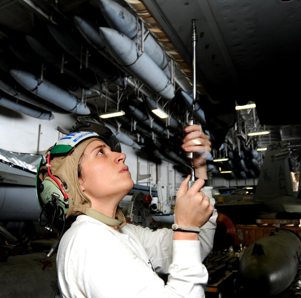 US Navy 100919-N-6427M-050 Aviation Structural Mechanic 3rd Class Kristen Campbell assigned to Strike Fighter Squadron (VFA) 32, replaces a panel a