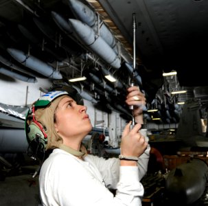 US Navy 100919-N-6427M-050 Aviation Structural Mechanic 3rd Class Kristen Campbell assigned to Strike Fighter Squadron (VFA) 32, replaces a panel a
