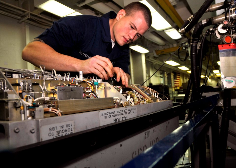 US Navy 100921-N-7103C-025 Seaman William Slaymaker, from Ft. Lauderdale, Fla., swaps radar frequency lines in an ALQ-99 universal radar signal exc