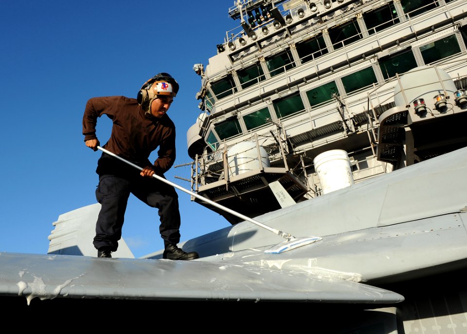 US Navy 100921-N-2821G-036 Sailor washes a jet aboard USS Abraham Lincoln