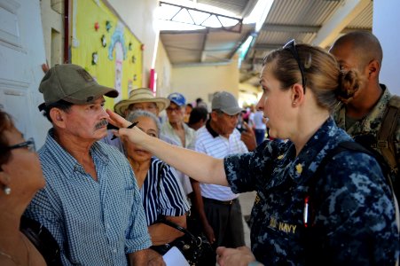 US Navy 100928-N-9964S-004 Lt. Cmdr. Tamara Braghieri and Sgt. Kenneth Gutierrez talk to Panamanians at a medical site in Panama photo