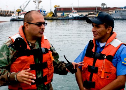 US Navy 100920-N-9095H-008 Chief Boatswain's Mate Jack Bustillos, left, mission commander of the security force assistance mobile training team,