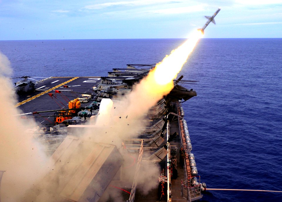 US Navy 100921-N-9950J-060 The forward-deployed amphibious assault ship USS Essex (LHD 2) launches a RIM-7P Sea Sparrow missile from the ship's for