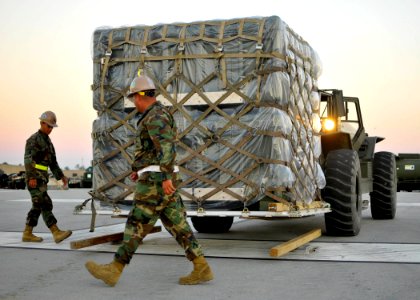 US Navy 100929-N-4440L-091 Seabees assigned to Naval Mobile Construction Battalion (NMCB) 74 weigh pallets during a mount out exercise at Naval Con
