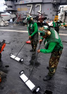 US Navy 100922-N-7103C-099 Aviation Boatswain's Mate (Equipment) 3rd Class Joshua Lewis, from Aliceville, Ala., right, and Aviation Boatswain's Mat