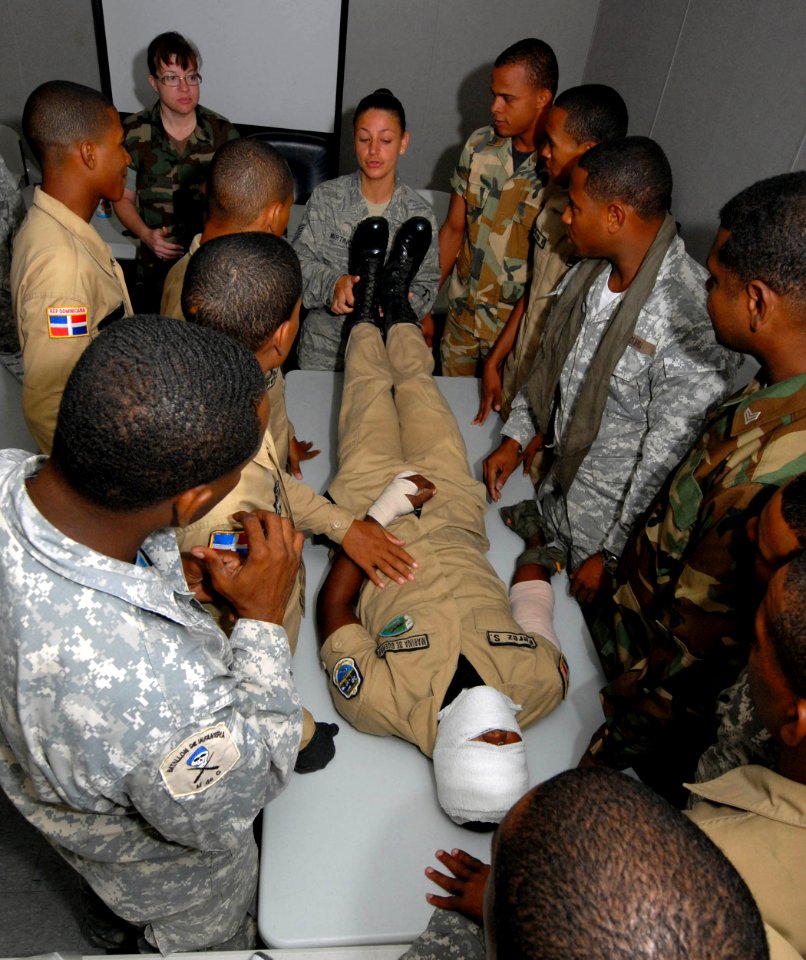 US Navy 100922-N-4971L-031 Chief Hospital Corpsman Tracie Ham, back left, from Roxboro, N.C., and Tech. Sgt. Yvonne Martino, from Tampa, Fla., back
