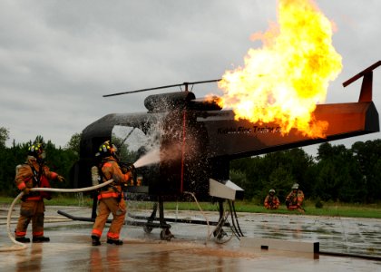 US Navy 101001-N-3737T-159 Navy first responders extinguish a simulated helicopter fire during an emergency services exercise at Naval Weapons Stat photo