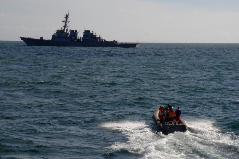 US Navy 100929-N-2855B-067 A rigid-hull inflatable boat peeds toward SS Stout (DDG 55) during maritime interdiction operations training