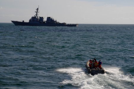 US Navy 100929-N-2855B-067 A rigid-hull inflatable boat peeds toward SS Stout (DDG 55) during maritime interdiction operations training