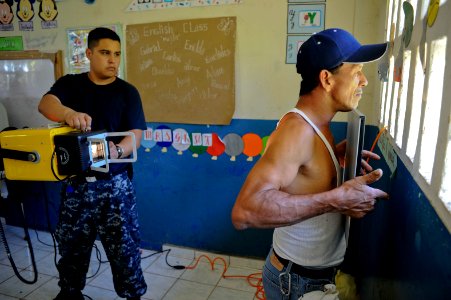 US Navy 100928-N-9964S-071 Hospital Corpsman 2nd Class Christian Huerta, assigned to the multi-purpose amphibious assault ship USS Iwo Jima (LHD 7)