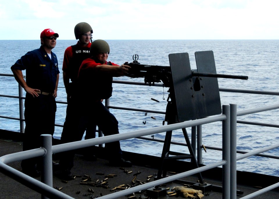 US Navy 100925-N-6632S-127 Sailors assigned to the weapons department of the aircraft carrier USS George H.W. Bush (CVN 77) fire a .50-caliber mach