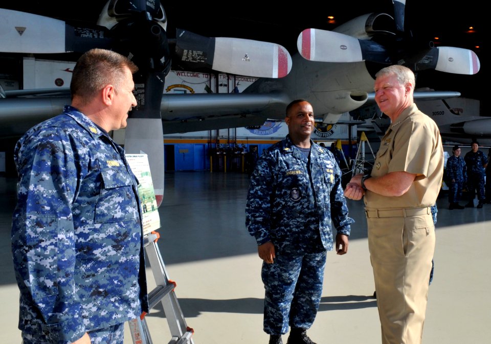US Navy 101004-N-8273J-199 hief of Naval Operations (CNO) Adm. Gary Roughead speaks with Master Chief Aircraft Maintenanceman Gary Donner and Comma