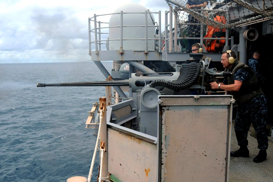 US Navy 100926-N-7680E-165 Aviation Support Equipment Technician 2nd Class Darin Estep, from Jacksonville, Fla., fires a MK 38 25mm chain gun durin