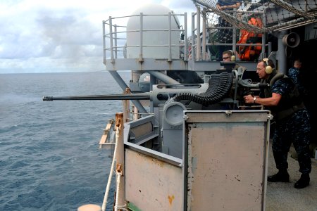 US Navy 100926-N-7680E-165 Aviation Support Equipment Technician 2nd Class Darin Estep, from Jacksonville, Fla., fires a MK 38 25mm chain gun durin