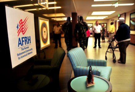 US Navy 101004-N-7367K-006 esidents who were evacuated to Washington, D.C. after Hurricane Katrina return to the Armed Forces Retirement Home photo