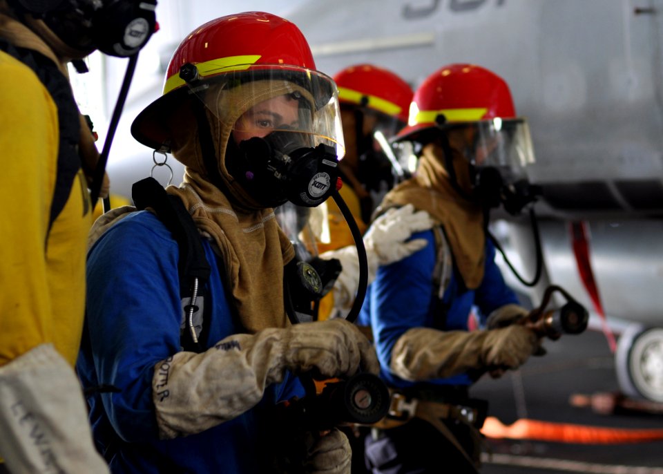 US Navy 100930-N-2013O-046 Aviation Boatswain's Mate (Handling) Airman Recruit Matthew Potter, from Salem, Ore., mans a fire hose during a mass cas