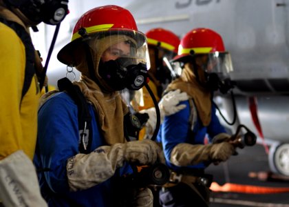 US Navy 100930-N-2013O-046 Aviation Boatswain's Mate (Handling) Airman Recruit Matthew Potter, from Salem, Ore., mans a fire hose during a mass cas