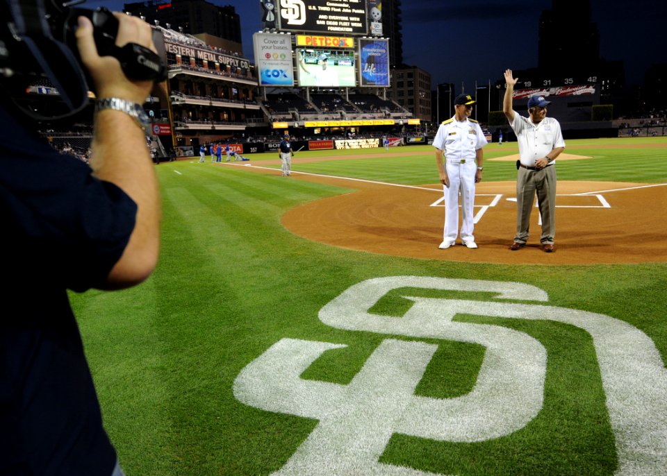 US Navy 100929-N-2055M-198 Vice Adm. Richard Hunt and John Pettitt stand at home plate to be recognized during a military appreciation game at Petc