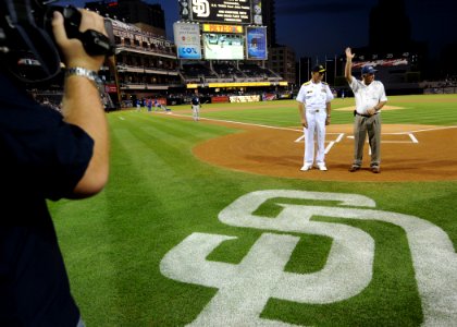 US Navy 100929-N-2055M-198 Vice Adm. Richard Hunt and John Pettitt stand at home plate to be recognized during a military appreciation game at Petc