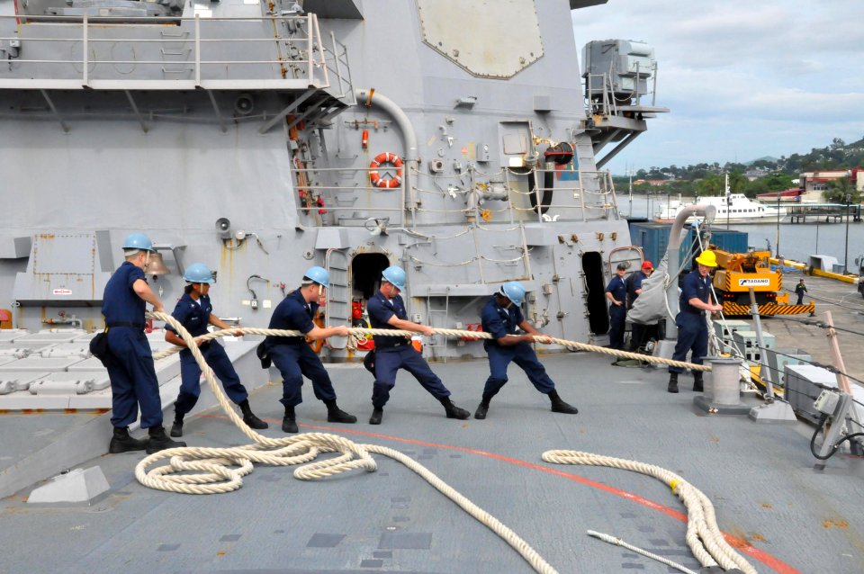 US Navy 101002-N-0966O-004 Sailors heave around lines on the foc'sle of the Arleigh Burke-class guided-missile destroyer USS Lassen (DDG 82)