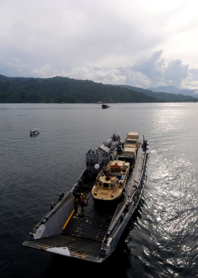 US Navy 100927-N-7680E-100 Landing Craft Utility (LCU) 1657 departs the well deck of the multi-purpose amphibious assault ship USS Iwo Jima (LHD 7)