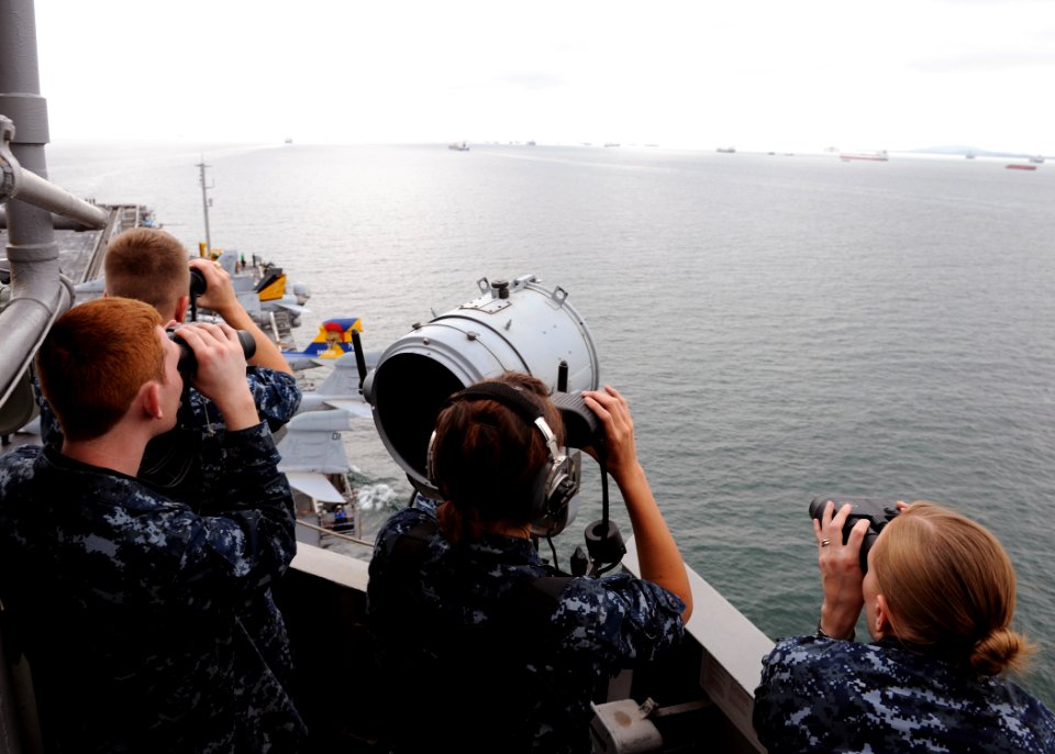 US Navy 101007-N-4973M-058 Sailors stand sighting watch as the aircraft carrier USS Abraham Lincoln (CVN 72) transits the Strait of Malacca