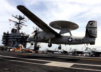 US Navy 101006-N-4973M-064 Landing signal officers communicate with the pilots as aircraft make their approach to the flight deck of the aircraft c