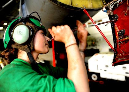 US Navy 101003-N-6427M-079 Aviation Electronics Technician 2nd Class Mandie Ellis emoves a worn out shock mount on a EA-6B Prowler