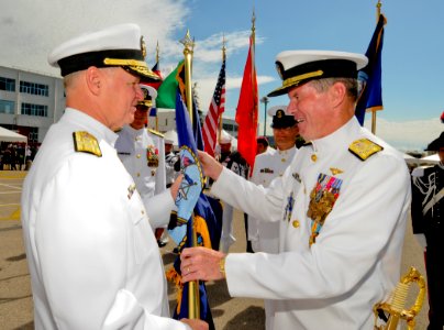 US Navy 101006-N-6138K-166 Adm. Mark Fitzgerald, right, passes the U.S. Navy flag to Chief of Naval Operations (CNO) Adm. Gary Roughead photo