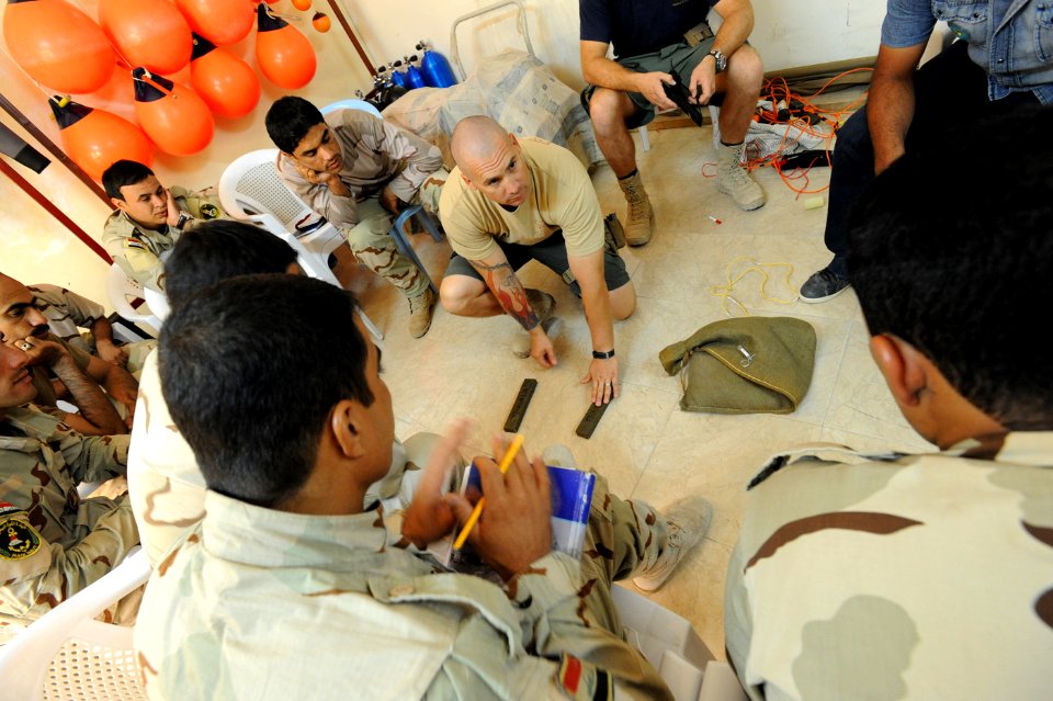 US Navy 101006-N-0413B-012 Navy Diver 1st Class John Neal, center, assigned to Mobile Diving and Salvage Unit (MDSU) 2,
