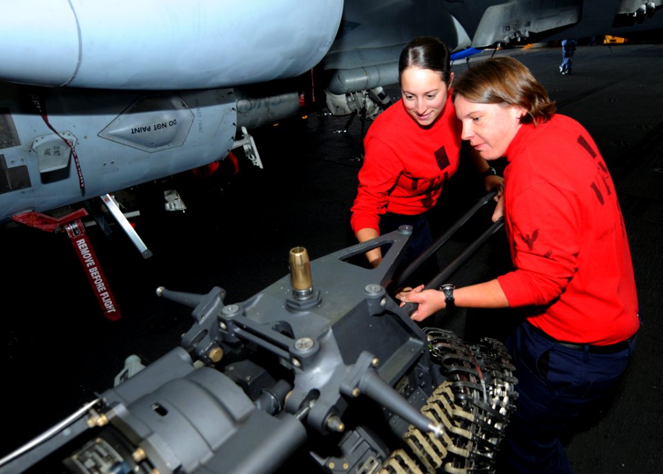 US Navy 101006-N-6632S-086 Sailors remove the barrels from an M61A2 20mm gun