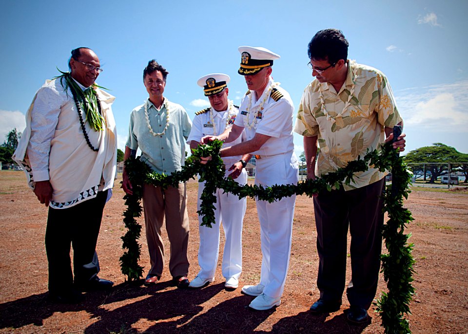 US Navy 101005-N-0995C-032 Capt. John Coronado, along with Capt. Rick Kitchens, untie the Maile Lei at the Ford Island Child Development Center gr
