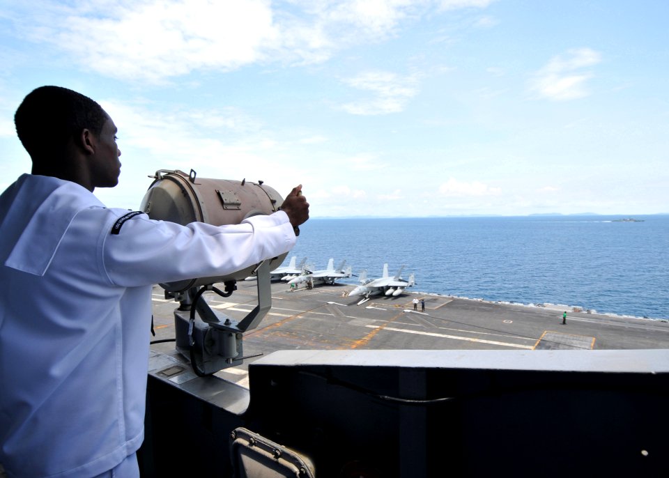 US Navy 101007-N-9643S-015 Quarter Master Seaman Jason Gibson signals to the Royal Thai Navy frigate HTMS Kraburi (FF47)