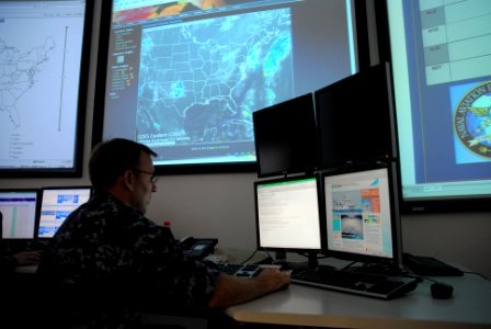 US Navy 101003-N-1580K-616 Aerographer's collects and analyzes weather observations at the Naval Aviation Forecast Center at Naval Station Norfolk