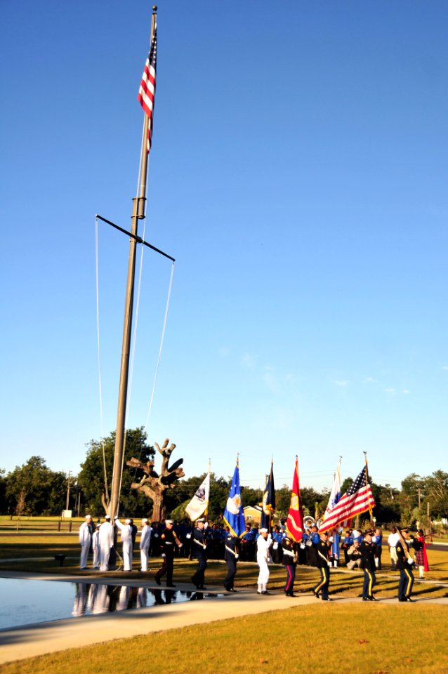 US Navy 101004-N-7367K-002 An honor guard raises the American flag during the reopening ceremony for the Armed Forces Retirement Home