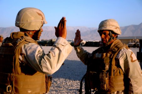 US Navy 101002-N-6436W-026 Equipment Operator 1st Class David Rivas reenlists at Camp Deh Dadi II in Northern Afghanistan