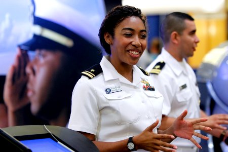 US Navy 101001-N-8863V-394 Lt. j.g. Erica Reid-Dixon and Lt. j.g. Carlos Iguina engage visitors to the U.S. Navy's booth during the 2010 Mexican Am