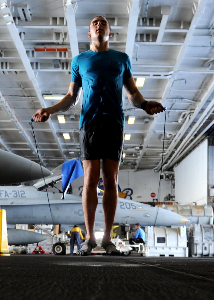 US Navy 101004-N-6427M-149 Airman David Hall, from Buffalo, N.Y., jumps rope during a training session in the hangar bay aboard the aircraft carrie