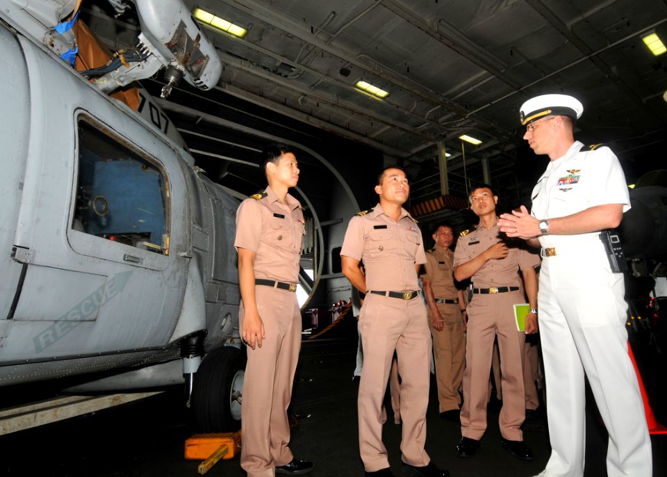 US Navy 101004-N-9643S-018 Ensign Shawn Horigan gives a tour of the hangar bay to members of the Royal Thai Navy aboard the aircraft carrier USS Ge