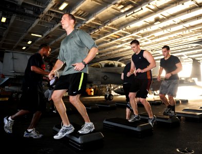 US Navy 101005-N-3793B-152 Sailors and Marines participate in the Spartan workout in the hangar bay aboard the aircraft carrier USS Harry S. Truman