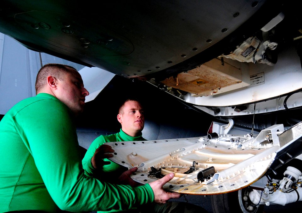 US Navy 101006-N-8913A-056 Aviation Electrician's Mates 2nd Class Matthew C. Sereda, right, and William K. Bishop, both assigned to the Shadowhawks