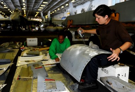 US Navy 101005-N-3793B-104 Aviation Structural Mechanic Airman Alexandria Ashpy, left, from San Diego, and Aviation Structural Mechanic Airman Liz